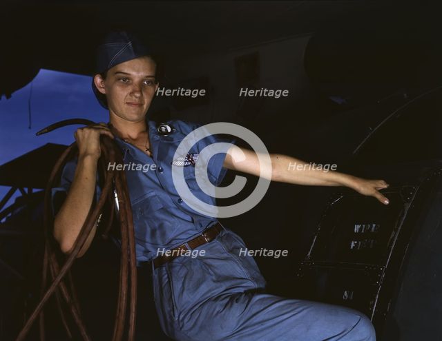 With a woman's determination, Lorena Craig takes over a man-size job, Corpus Christi, Texas, 1942. Creator: Howard Hollem.