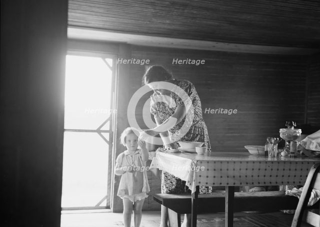 Wife and child of tobacco sharecropper, Person County, North Carolina, 1939. Creator: Dorothea Lange.