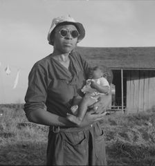 Wife and child of tractor driver, Aldridge Plantation, Mississippi, 1937. Creator: Dorothea Lange