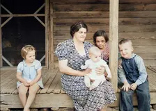 Wife and children of tobacco sharecropper on front porch, Person County, North Carolina, 1939. Creator: Dorothea Lange