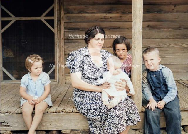 Wife and children of tobacco sharecropper on front porch, Person County, North Carolina, 1939. Creator: Dorothea Lange.