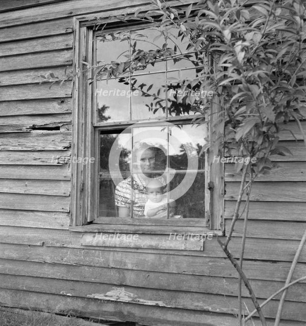Wife and five month old baby of young tobacco sharecropper..., Granville County, N Carolina, 1939. Creator: Dorothea Lange.
