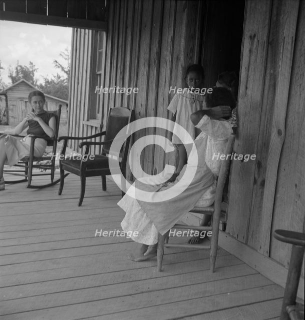 Wife of tenant farmer with two of her six children..., Chatham County, N Carolina, 1939. Creator: Dorothea Lange.