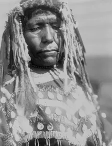 Wife of Weasel Head-Piegan, c1910. Creator: Edward Sheriff Curtis