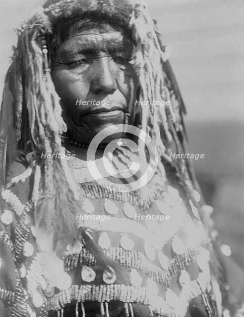 Wife of Weasel Head-Piegan, c1910. Creator: Edward Sheriff Curtis.