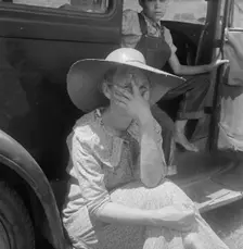 Wife of sharecropper in town to sell their crop at the tobacco auction, Douglas, Georgia, 1938. Creator: Dorothea Lange
