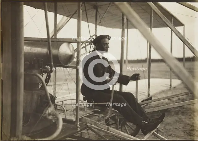 Wilbur Wright in the flyer, 1908. Creator: Anonymous.
