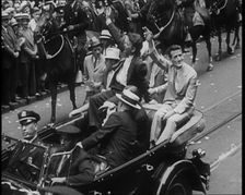 Wiley Post Sitting in a Car with Other Men, 1933. Creator: British Pathe Ltd