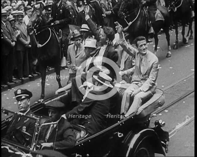 Wiley Post Sitting in a Car with Other Men, 1933. Creator: British Pathe Ltd.