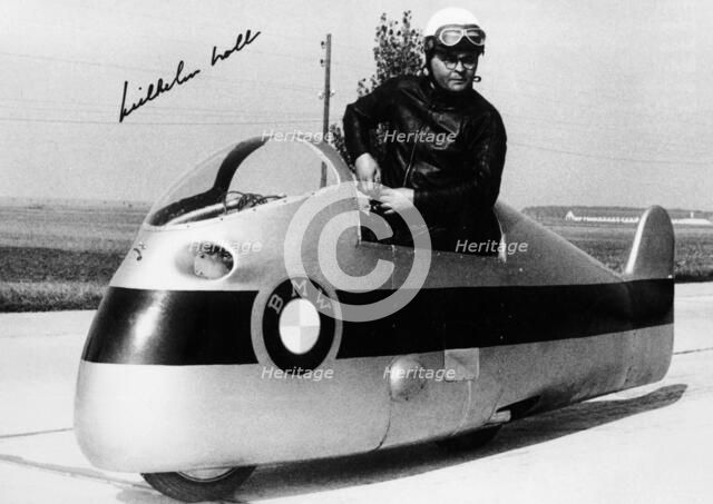 Wilhelm Noll on a 500cc BMW motorcycle, 1955. Artist: Unknown