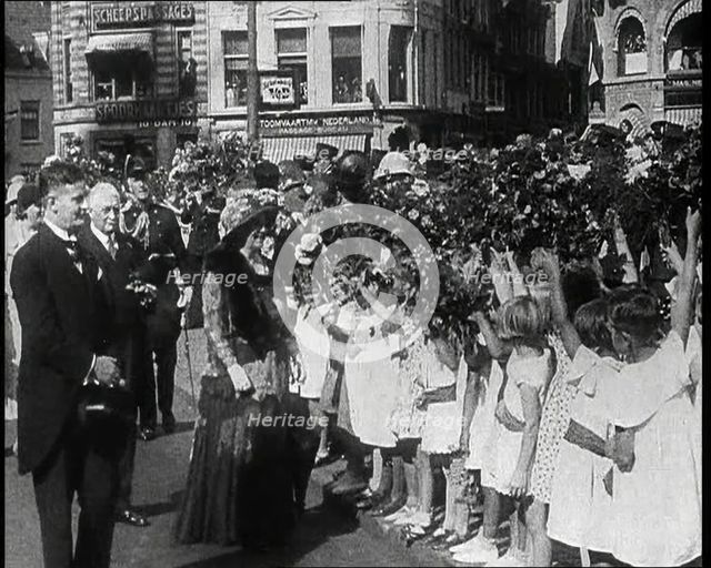 Wilhelmina, Her Majesty the Queen of the Netherlands Taking Flowers from Young Girls, 1930s. Creator: British Pathe Ltd.