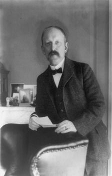 William Woodville Rockhill, half-length portrait, standing, facing left, between 1890 and 1910. Creator: Frances Benjamin Johnston