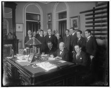 William Jennings Bryan with group at desk, between 1910 and 1920. Creator: Harris & Ewing
