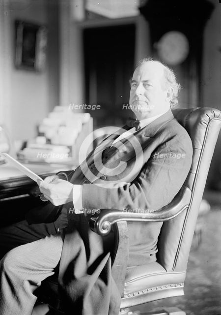 William Jennings Bryan, Rep. from Nebraska, at desk, 1914. Creator: Harris & Ewing.