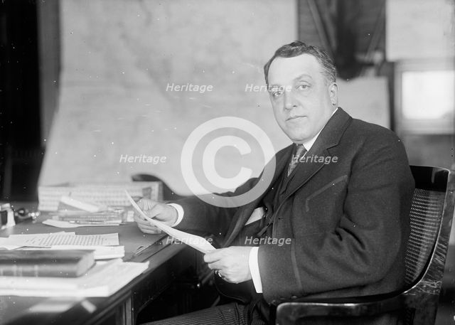 William Moulton Ingraham, Asst. Secretary of War, at Desk, 1916. Creator: Harris & Ewing.