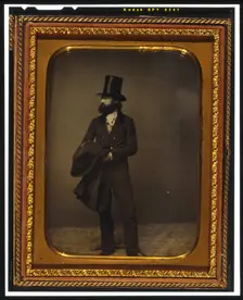 William Sidney Mount, full length portrait, facing left, wearing top hat..., between 1853 and 1860. Creator: Mathew Brady