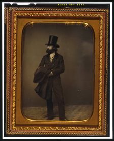 William Sidney Mount, full length portrait, facing left, wearing top hat..., between 1853 and 1860. Creator: Mathew Brady