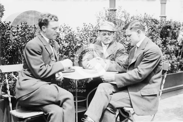 Willie Ritchie reading cable of acceptance to Steffen & Thiry, between c1910 and c1915. Creator: Bain News Service.