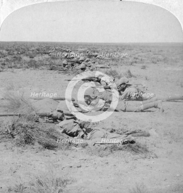 Wiltshire boys stealing on the enemy at the Orange River, South Africa, 2nd Boer War, 1900.  Artist: Underwood & Underwood