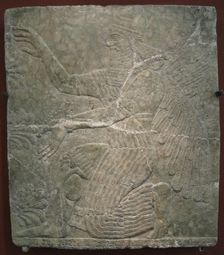 Winged deity by the sacred tree. Relief from the palace of Ashurnasirpal II at Kalhu, Nimrud, 9th century BC. Artist: Assyrian Art