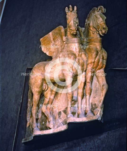 Winged horses, carved on Etruscan terracotta.