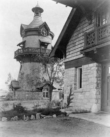 Windmill-shaped clock tower at left, and part of garage of Edmund..., Greenwich, Connecticut, 1908. Creator: Frances Benjamin Johnston