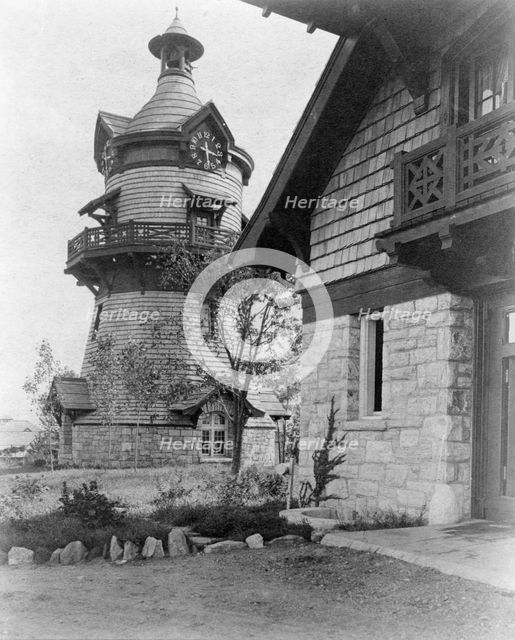 Windmill-shaped clock tower at left, and part of garage of Edmund..., Greenwich, Connecticut, 1908. Creator: Frances Benjamin Johnston.