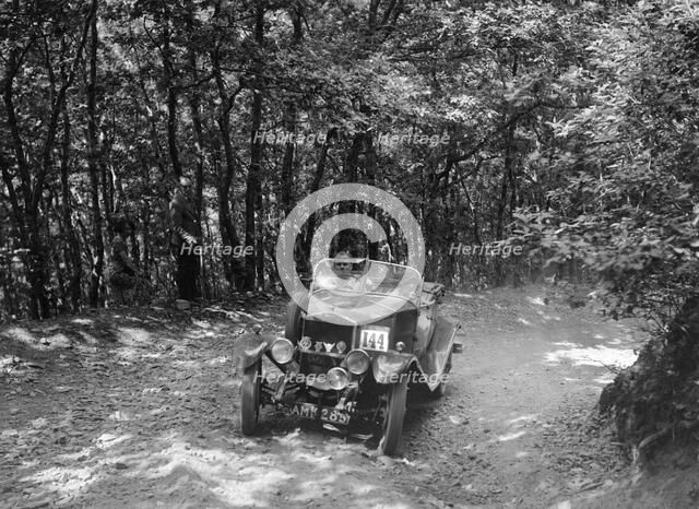 Windsor of CC Bliss competing in the B&HMC Brighton-Beer Trial, Fingle Bridge Hill, Devon, 1934. Artist: Bill Brunell.