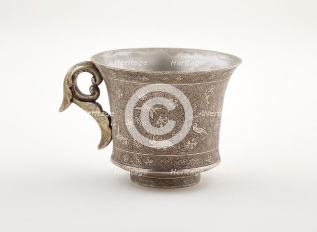 Wine cup with ring handle, birds, animals, and grape vines, Early Tang dynasty, late 7th century. Creator: Unknown.