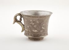 Wine cup with ring handle, birds, animals, and grape vines, Early Tang dynasty, late 7th century. Creator: Unknown