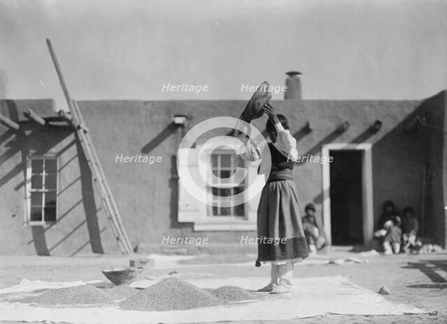 Winnowing wheat, c1905. Creator: Edward Sheriff Curtis.