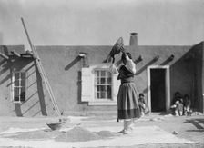 Winnowing wheat, c1905. Creator: Edward Sheriff Curtis