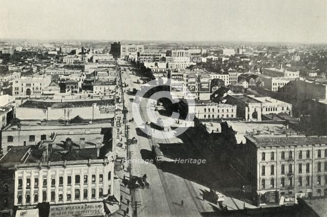 'Winnipeg To-Day; Looking Up Main Street. - The Rapid Growth of Modern Canada', c1930. Creator: Valentine & Sons Ltd.