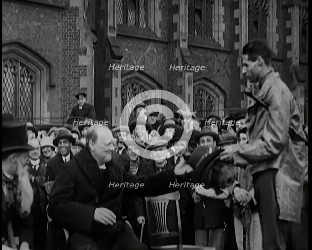 Winston Churchill, Chancellor of the Exchequer, Being Presented With an Irish Cap in Front..., 1926. Creator: British Pathe Ltd.