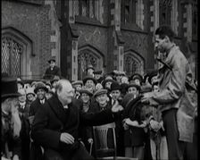 Winston Churchill, Chancellor of the Exchequer, Being Presented With an Irish Cap in Front..., 1926. Creator: British Pathe Ltd