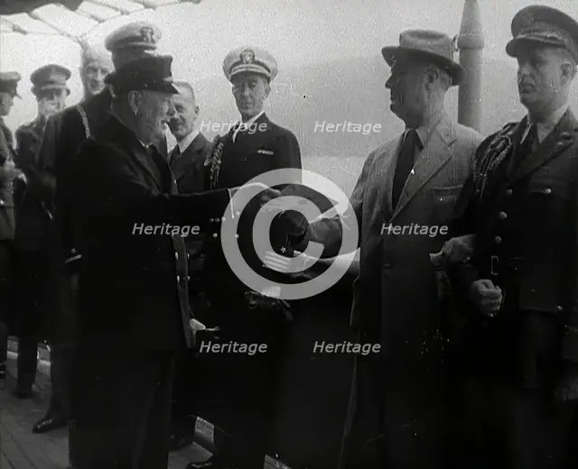 Winston Churchill Handing Franklin D. Roosevelt a Piece of Paper, 1941. Creator: British Pathe Ltd.