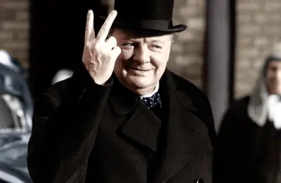 Winston Churchill making his famous V for Victory sign, 1942. Artist: Unknown