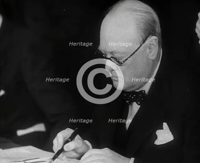 Winston Churchill Signing an Agreement Allowing the USA to use British Naval Bases in..., 1941. Creator: British Pathe Ltd.