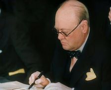 Winston Churchill Signing an Agreement Allowing the USA to use British Naval Bases in..., 1941. Creator: British Pathe Ltd