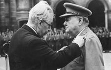 Winston Churchill receiving a military medal from Paul Ramadier, Paris, 1947. Creator: Unknown
