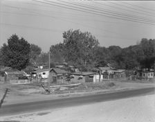 Winter migrant camp on the outskirts of Sacramento, California, 1936. Creator: Dorothea Lange