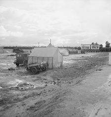 Winter quarters, migratory agricultural workers, beside the highway, Tulare County, CA, 1939. Creator: Dorothea Lange