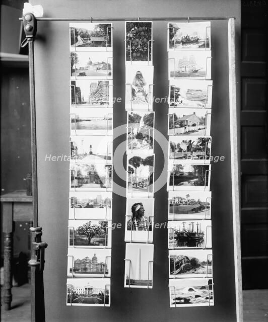 Wire postcard display rack, between 1900 and 1910. Creator: Unknown.
