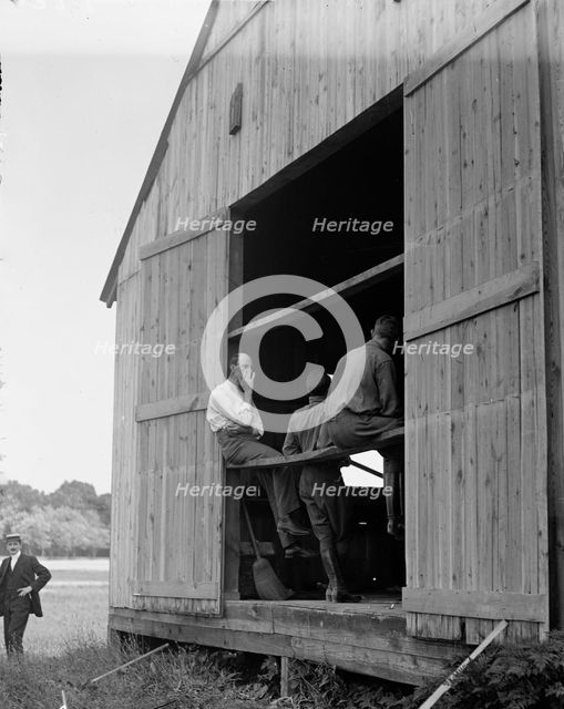 Wright Flights, Fort Myer, Va, July 1909 - Hangar, Wilbur Wright, Right, Showing His Objection To... Creator: Harris & Ewing.