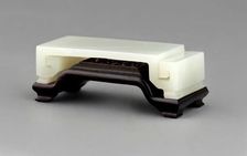 Wrist rest with wood stand. Creator: Unknown