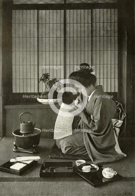 'Writing A Letter', 1910. Creator: Herbert Ponting.