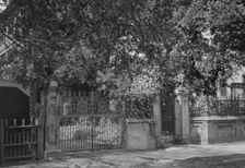 Wrought iron gate and fence, New Orleans or Charleston, South Carolina, between 1920 and 1926. Creator: Arnold Genthe