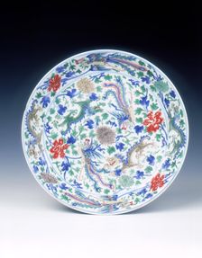 Wucai dish with dragons, phoenixes and floral scrolls, Qing dynasty, China, 1662-1722