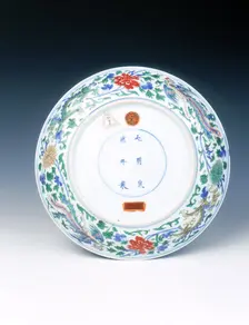 Wucai dish with dragons, phoenixes and floral scrolls, Qing dynasty, China, 1662-1722. Creator: Unknown