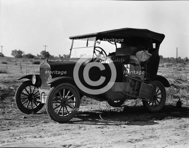 To serve the crops of California, thousands of families live on wheels, near Bakersfield, CA,1936. Creator: Dorothea Lange.